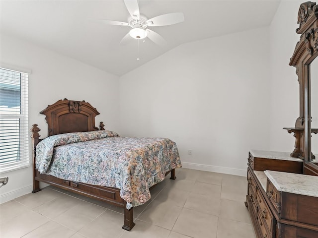 bedroom with light tile patterned floors, ceiling fan, and lofted ceiling