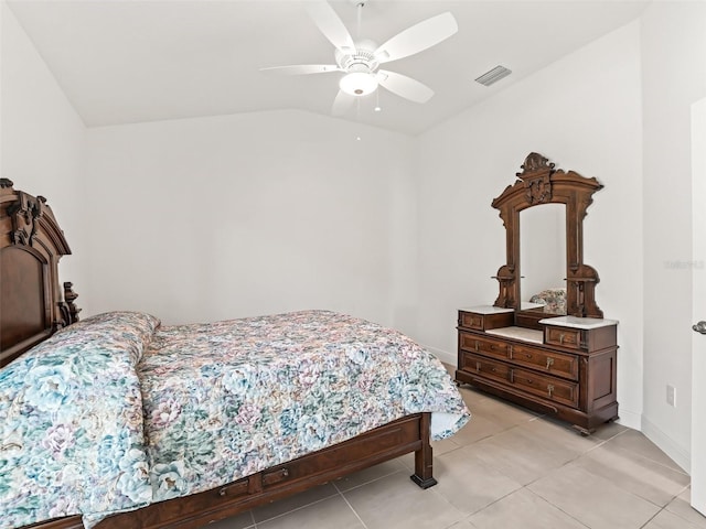 tiled bedroom with vaulted ceiling and ceiling fan