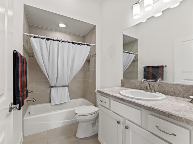 full bathroom featuring tile patterned floors, vanity, shower / bath combination with curtain, and toilet