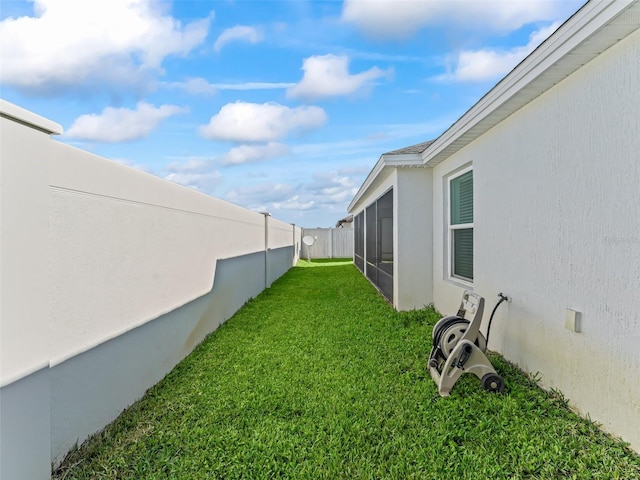 view of yard with a sunroom