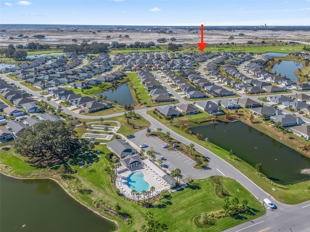 birds eye view of property with a water view