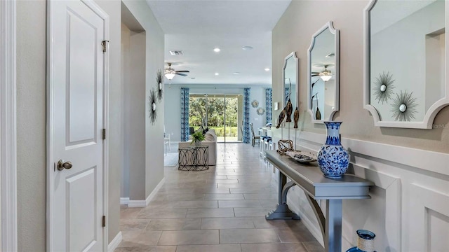 hallway featuring tile patterned flooring