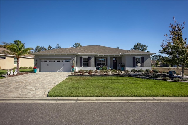 view of front facade featuring a front yard and a garage