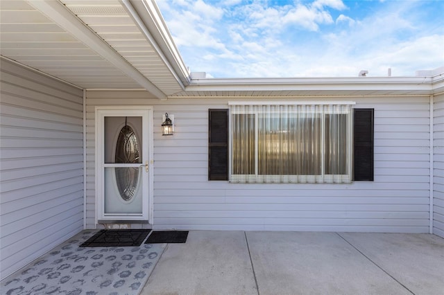 property entrance featuring a patio