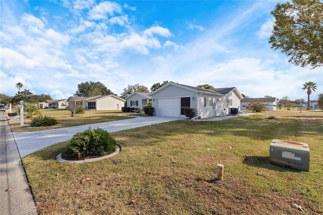 ranch-style home featuring a garage and a front lawn