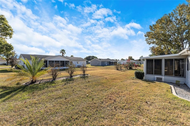 view of yard with a sunroom