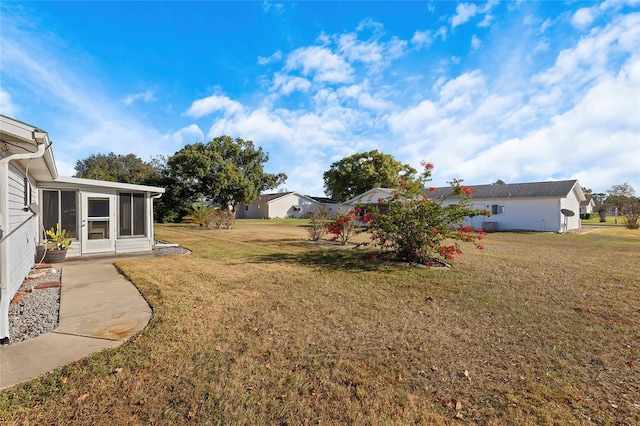 view of yard featuring a sunroom