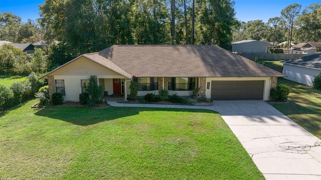 ranch-style home with a front yard and a garage