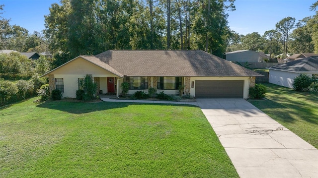 single story home featuring a front yard and a garage