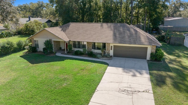 ranch-style home featuring a garage and a front yard