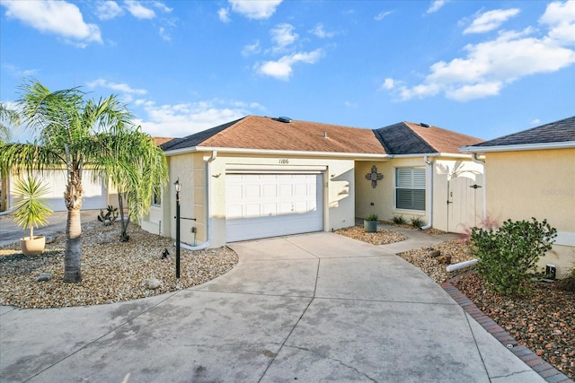 ranch-style home featuring a garage