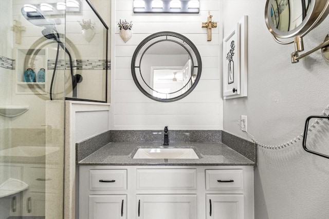 bathroom with vanity and an enclosed shower