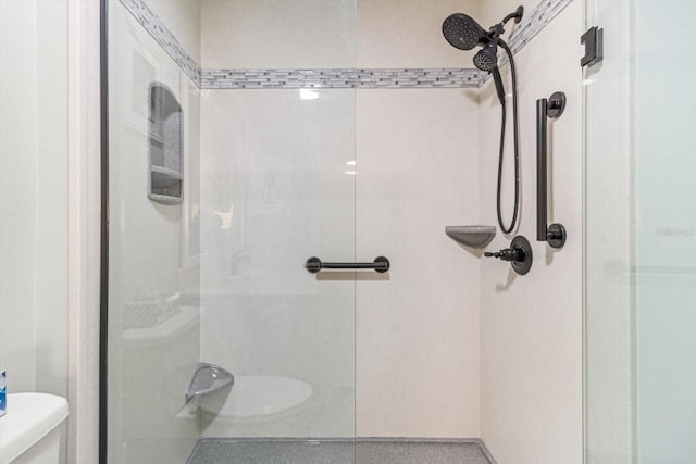 bathroom with tiled shower and toilet