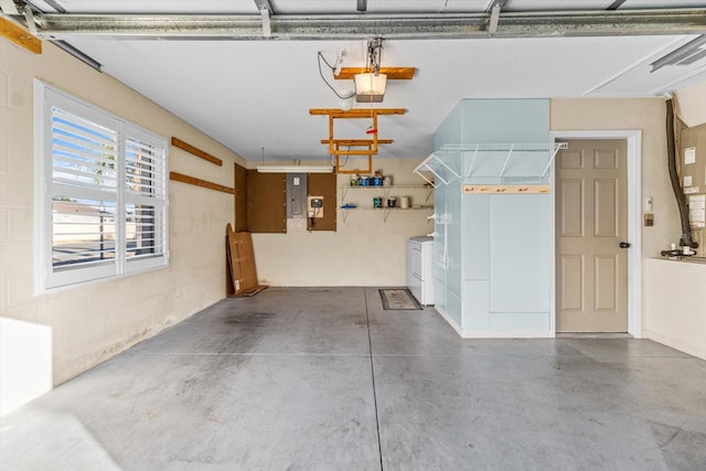 garage featuring a garage door opener and washing machine and clothes dryer