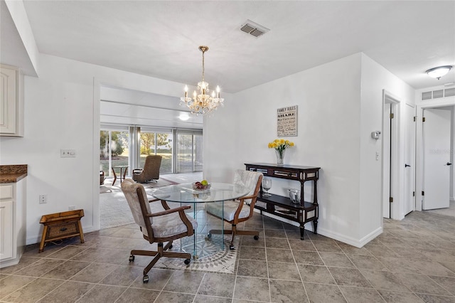 dining room with a notable chandelier