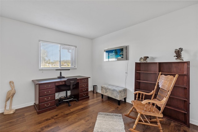 home office with dark hardwood / wood-style floors