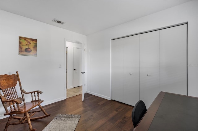 office space with dark wood-type flooring