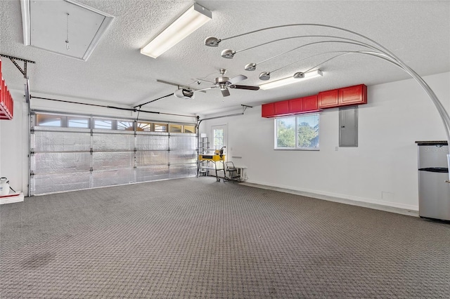 garage with electric panel, a garage door opener, and ceiling fan