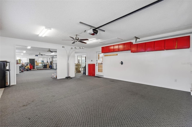 garage with ceiling fan and a garage door opener