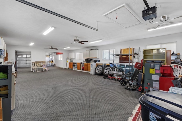 garage featuring ceiling fan and a garage door opener