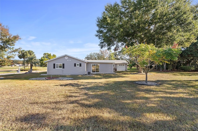 exterior space with a front yard and a garage