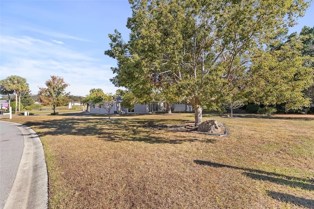 exterior space featuring a front lawn