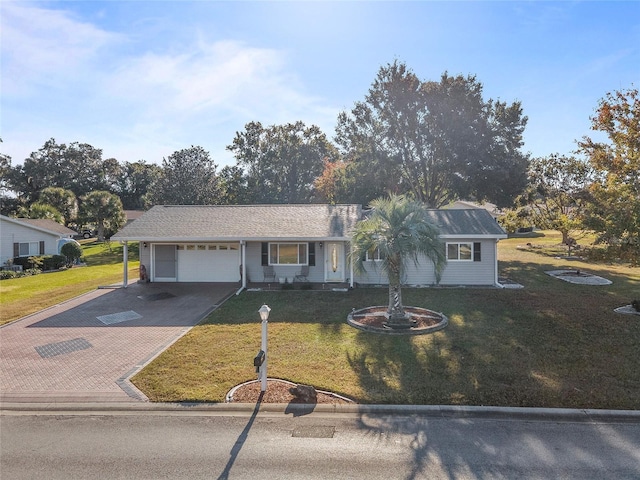 ranch-style home with a garage and a front yard