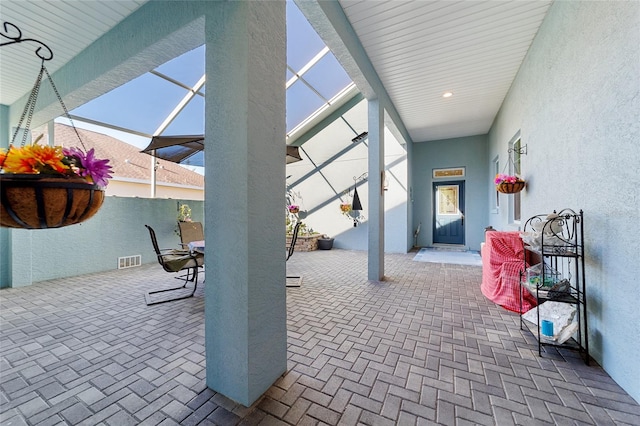 view of patio with a lanai