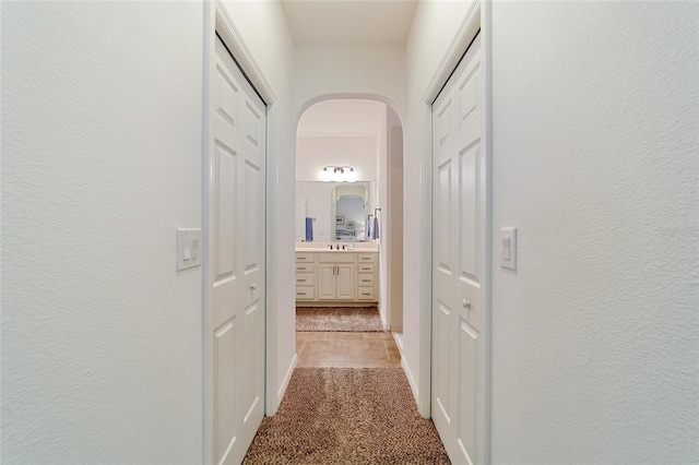 corridor with light colored carpet