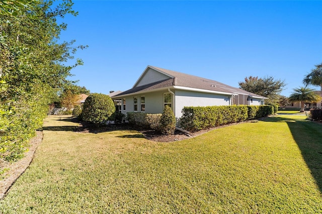 view of property exterior featuring a yard