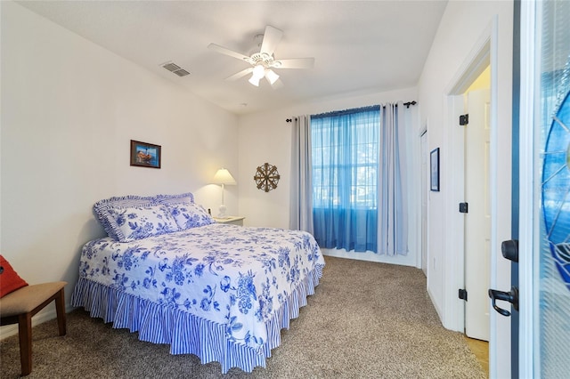 carpeted bedroom with ceiling fan