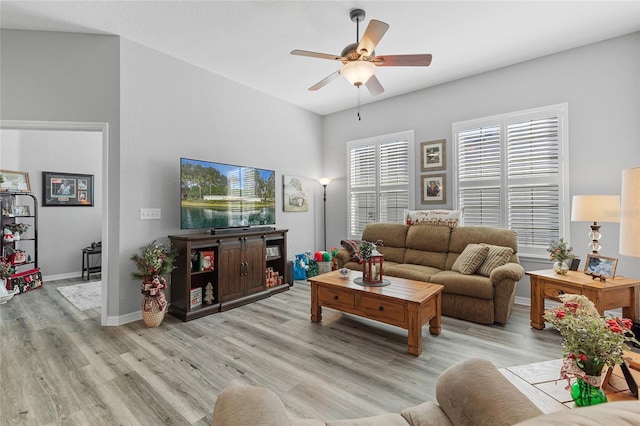 living room featuring light wood-type flooring and ceiling fan