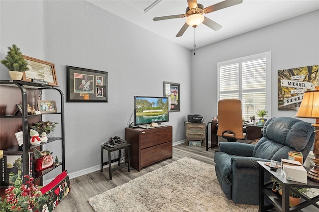 interior space featuring light wood-type flooring and ceiling fan