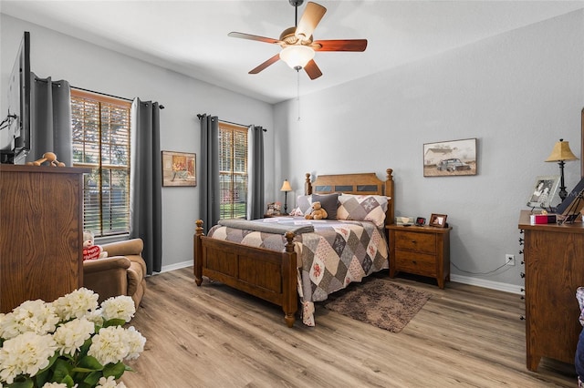 bedroom featuring ceiling fan and light hardwood / wood-style flooring