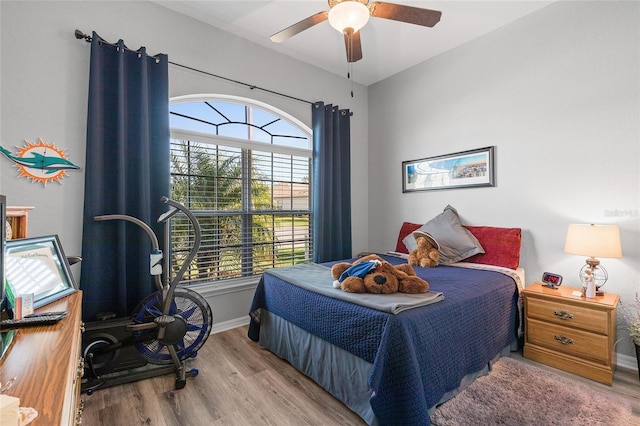 bedroom featuring ceiling fan and light hardwood / wood-style flooring