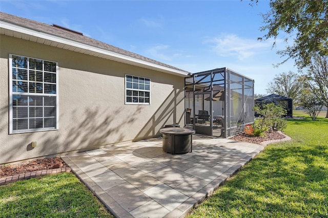 view of patio with a lanai