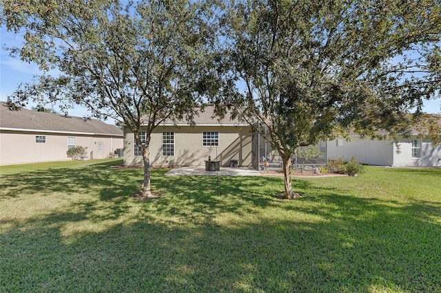 rear view of house with a lawn