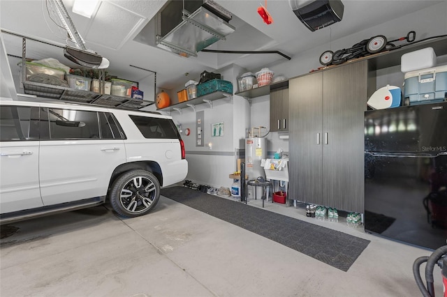 garage with black refrigerator and electric water heater