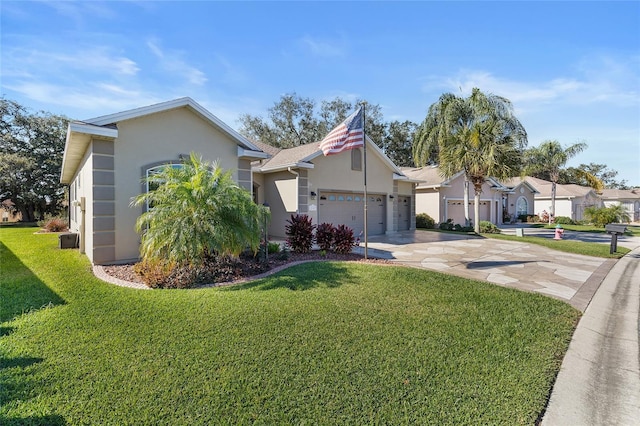 ranch-style home featuring a front lawn and a garage