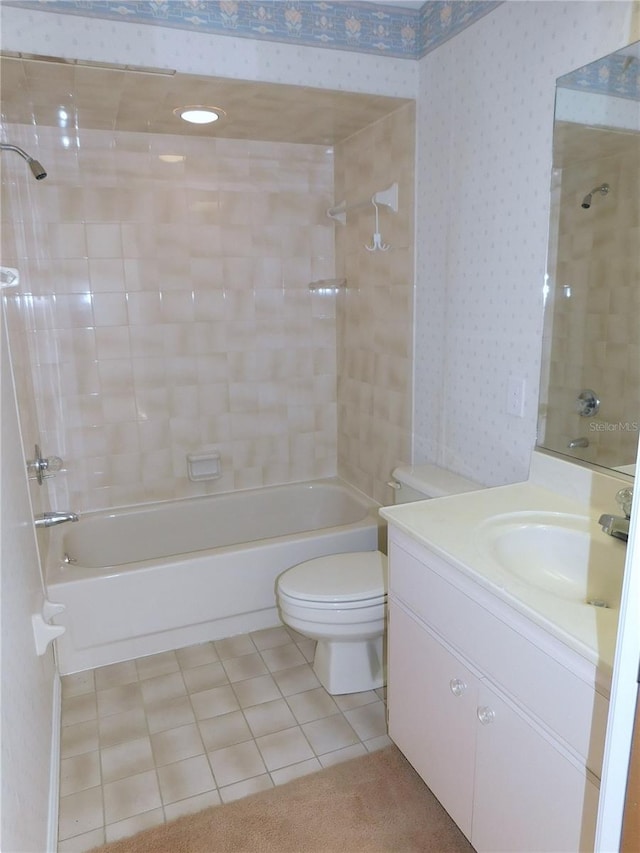 full bathroom with tile patterned floors, vanity, toilet, and tiled shower / bath