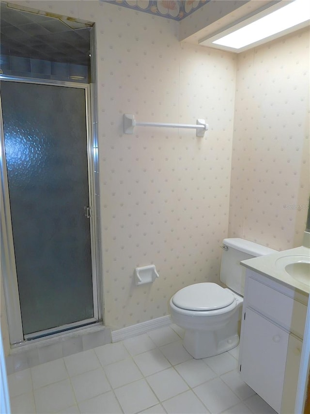 bathroom featuring tile patterned floors, vanity, an enclosed shower, and toilet