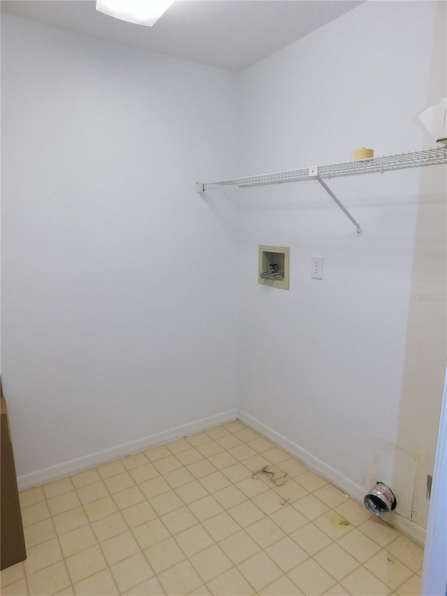 laundry room with washer hookup and light tile patterned floors