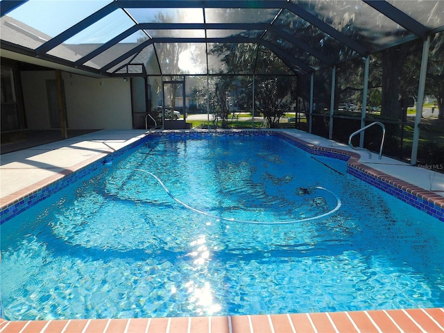 view of pool with a lanai