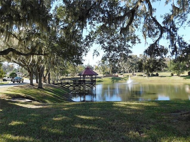 property view of water with a gazebo