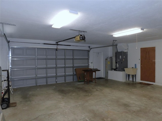 garage with electric water heater, sink, a garage door opener, and heating unit