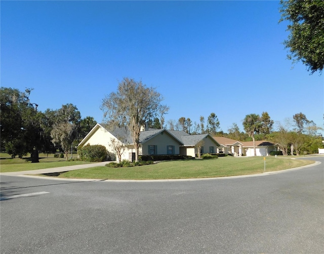 view of front of home with a front lawn