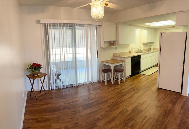 kitchen with white refrigerator, ceiling fan, black dishwasher, dark hardwood / wood-style flooring, and white cabinetry