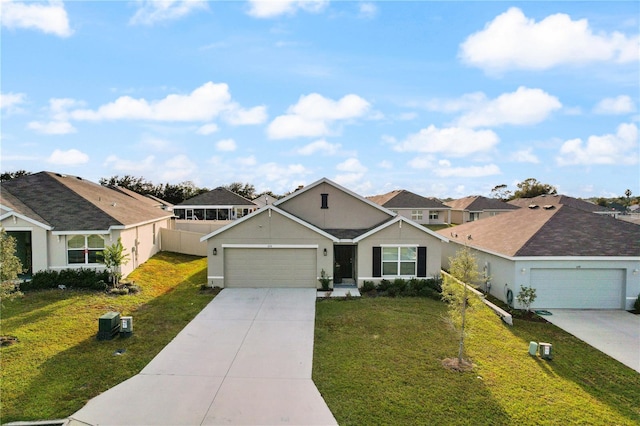 ranch-style home with a garage and a front lawn