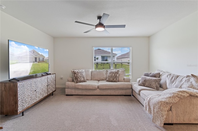 living room with carpet flooring and ceiling fan