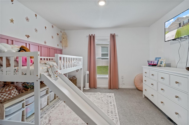 carpeted bedroom featuring multiple windows